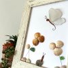 A lovely scene with a butterfly, snail, and flowers, made with seaglass and seashells, perfect as a unique gift! - Image 5