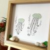 Two happy jellyfish made of seaglass swimming under the sea! Perfect sea inspired unique work!