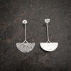 silver earrings with geometric patterns