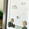 Seaglass Artwork with Birds and Clouds