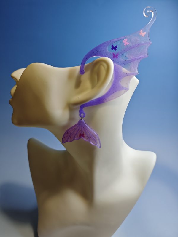 Purple mermaid ear with butterfly sequins on a mannequin