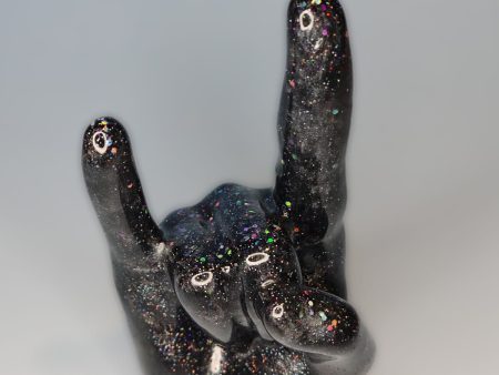 rocker sign hand. index and pinky finger up on a fist.