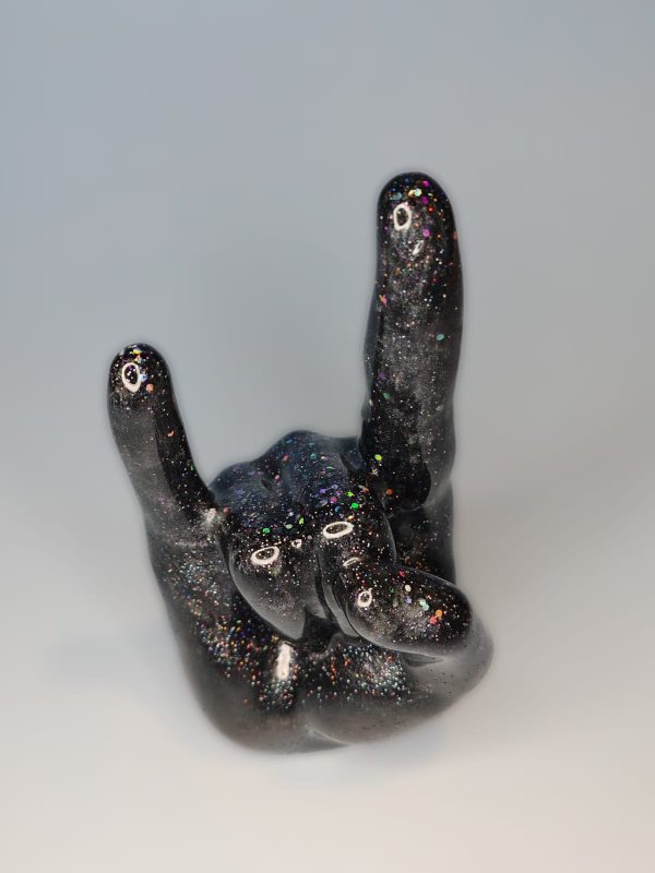 rocker sign hand. index and pinky finger up on a fist.