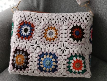 Beige granny square crochet bag with zipper and felt lining