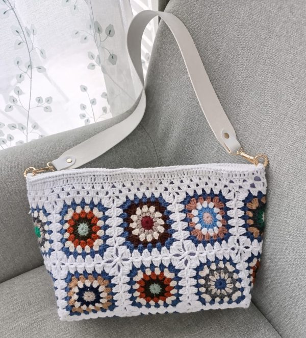 White granny square crochet bag with magnetic closure and felt lining