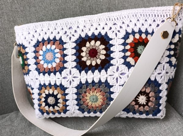 White granny square crochet bag with magnetic closure and felt lining