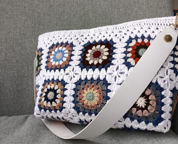 White granny square crochet bag with magnetic closure and felt lining